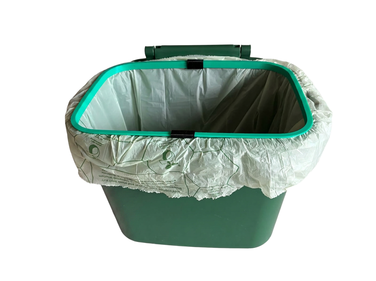Caddy Grip fitted over the caddy rim, holding the bin bag open